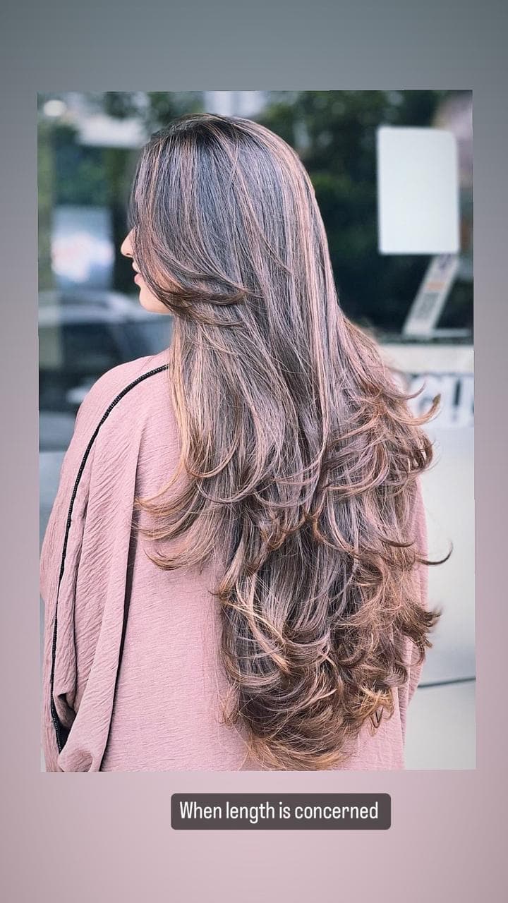 Sleek Black Hair with Subtle Lowlights and Smooth Finish